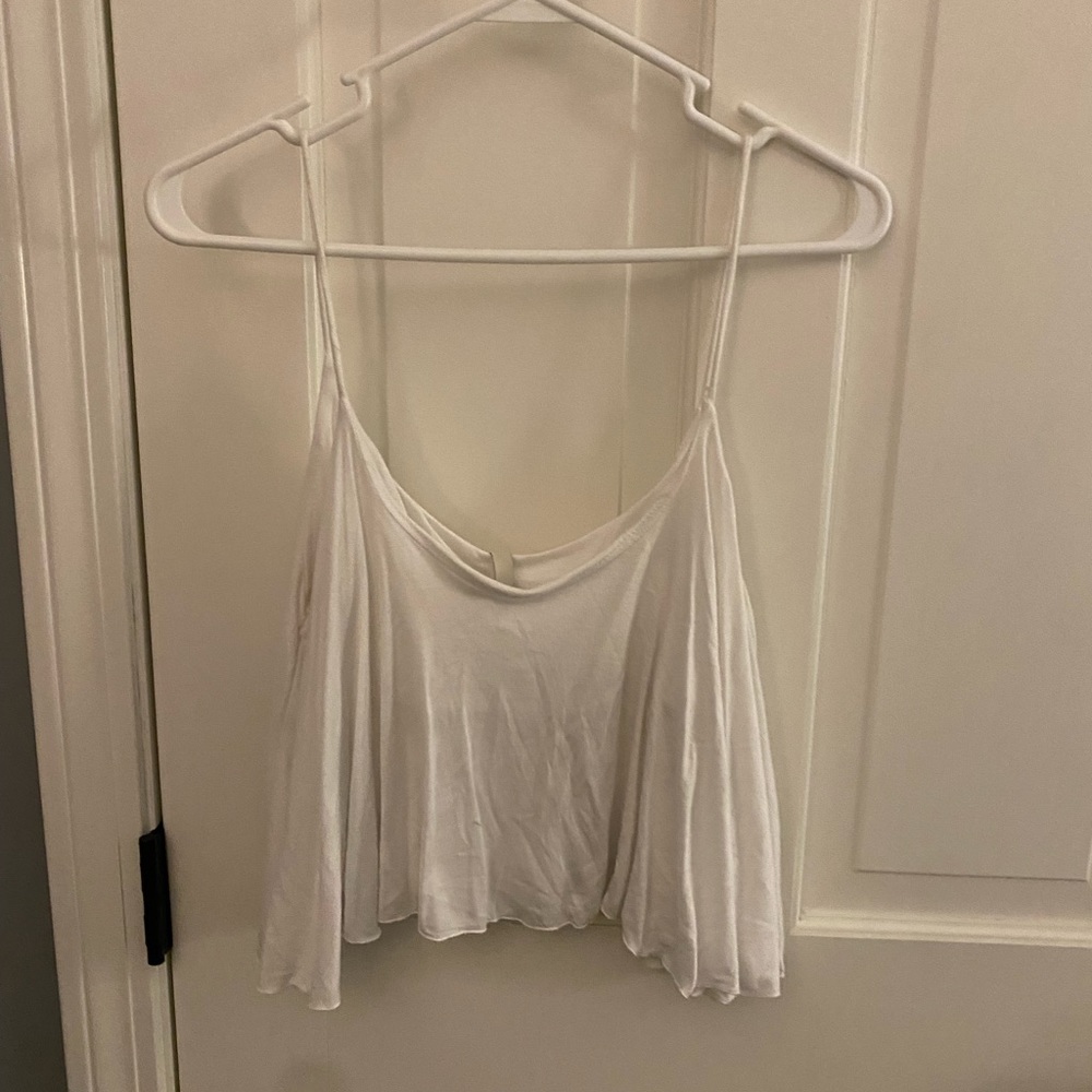 white flowy cropped shirt.